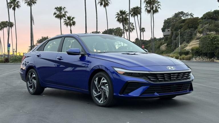 2025 Hyundai Elantra Hybrid by palm trees.